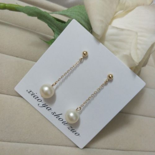 Boucles d'oreilles pendantes LOVE en Nacre - Ref 3098790
